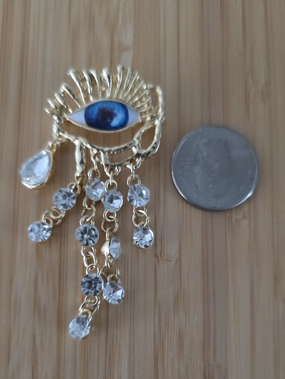 Gold Evil Eye Dangle Brooch with Blue Center and Crystal Drops